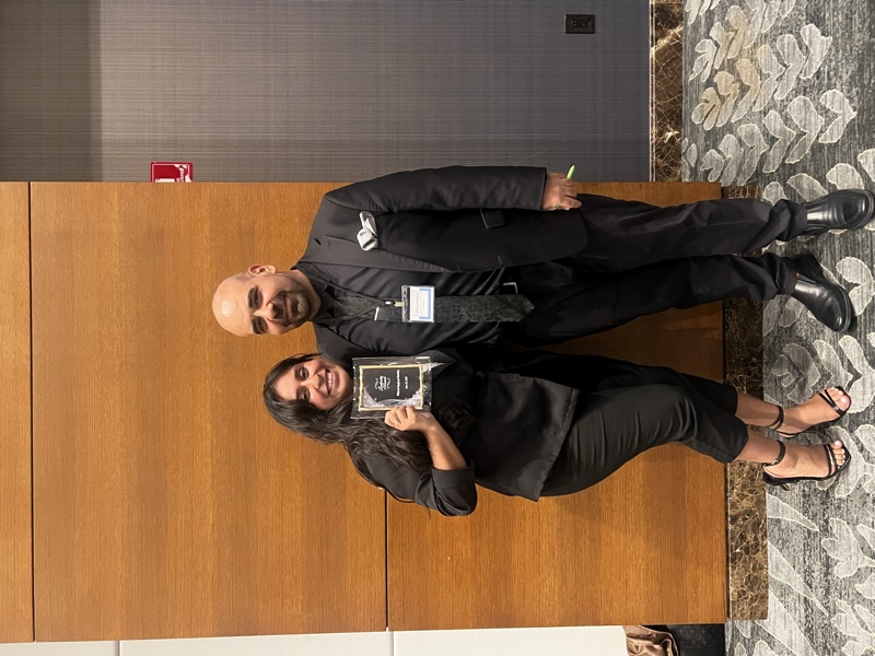 Dynamic sales team celebrating wins at a team meeting